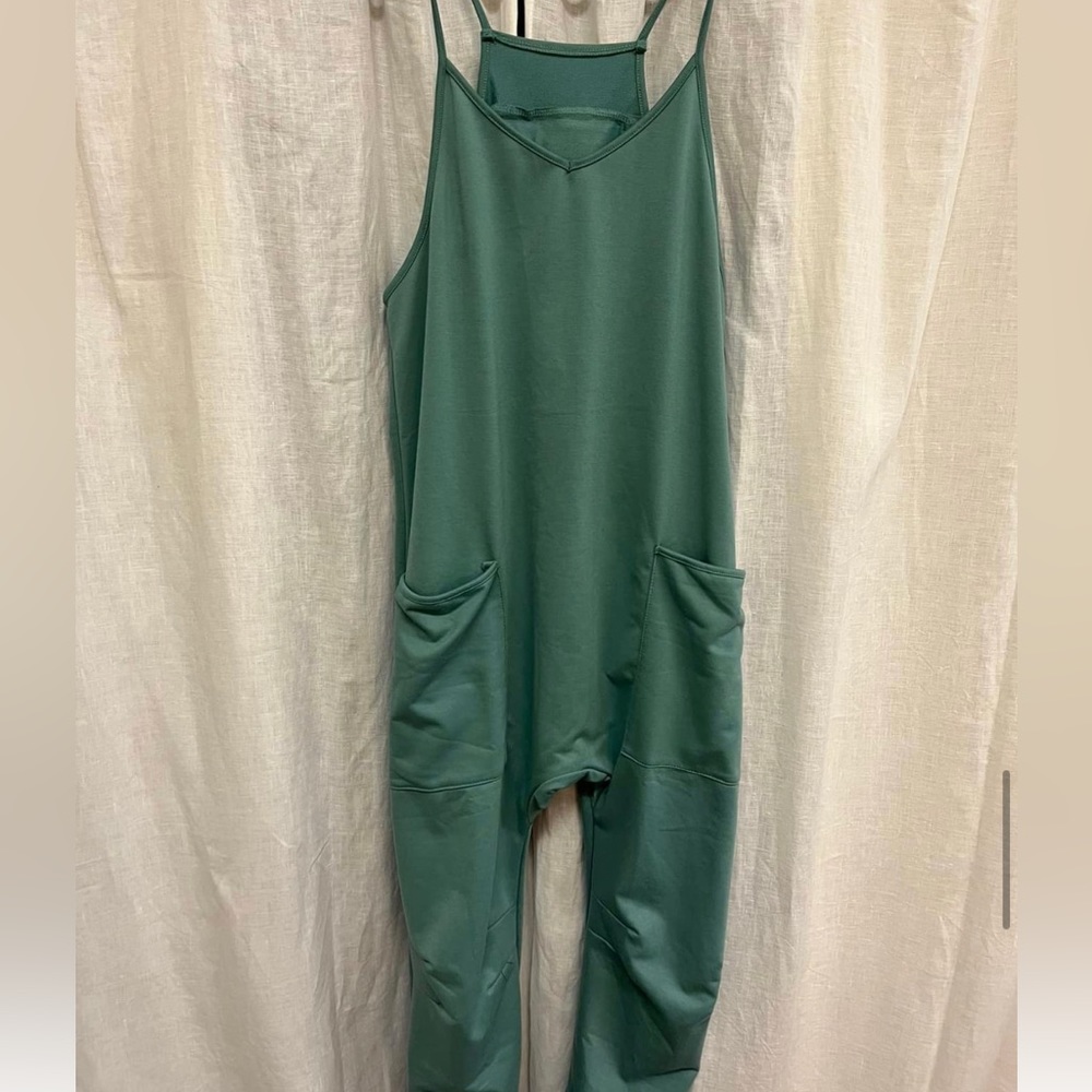 Sage romper with pockets. Stretches easily and good for a looser fit.